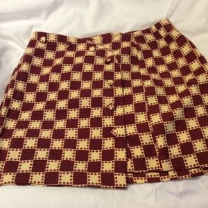 Urban outfitters , skirt size SP multi color burgundy and gold